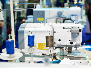 Spools of thread and sewing machines