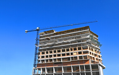 Crane and highrise construction site