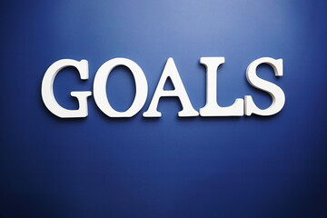 Goals alphabet letter on blue background