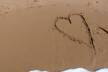 Heart draw on the shore of the sea