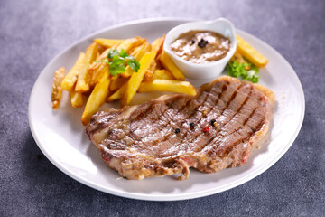 grilled beef steak and french fries