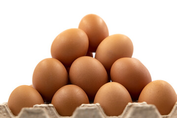Egg. Organic eggs in a box in the shape of a pyramid close up. Egg isolate on a white background