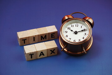 Tax Time alphabet letter with alarm clock on blue background