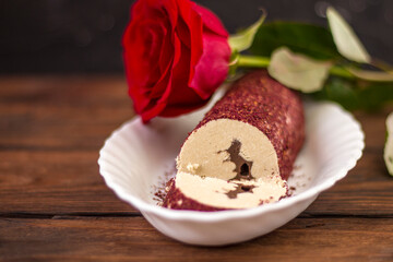 Eastern sweet halva with chocolate and rose powder on wooden background.