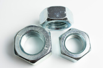 large nuts made of silver metal close up