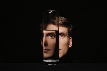 portrait of a man through the glass of a water