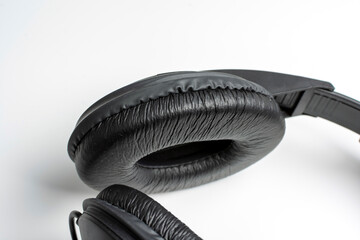 close-up of black headphone on white background