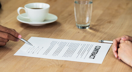 Job interview with signing contract to interviewer