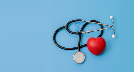 Stethoscope and red hearts on a blue background Health care concept.