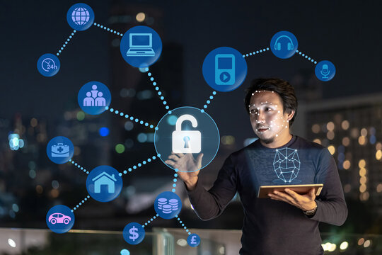 Asian creative freelancer using technology tablet with authentificate by Face detection and recognition with various internet of things icon, Biometric Verification and artificial intelligence concept