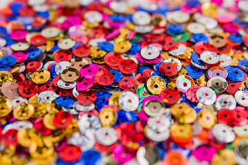 Fototapeta na wymiar beautiful festive background multicolored with bokeh and sequins
