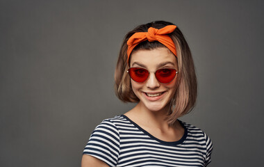 pretty woman with glasses in a striped t-shirt headband