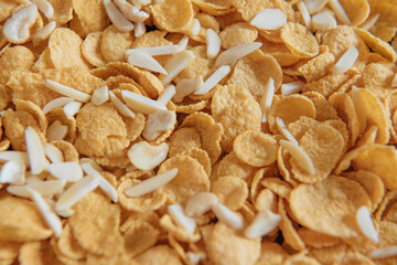 Cornflakes background with almond and texture. Close up top view textures.