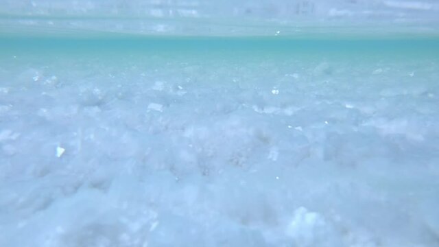 Underwater view of the salt crystals of Uyuni salt flat in Bolivia