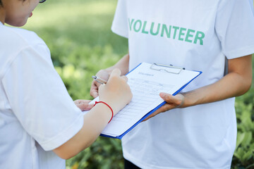 Vounteer inviting people to join their non-profit organization and asking woman to write her...