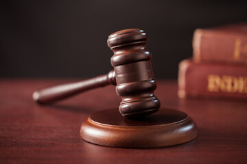 close up of a gavel on dark backround.