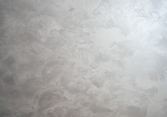 Decorative plaster. Grey wall texture background. Concrete style. Restoration indoors. Maintenance works.