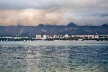 Big cloud over the city in the mountains