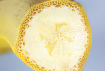 Close up photo of banana on white background. Bananas fruit cut in half, macro view.