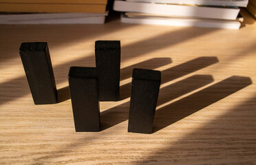 black cubic blocks with falling shadows