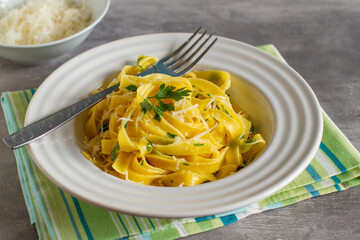 italian pasta fettuccine with olive oil , parsley and parmesan cheese
