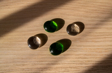 multicolored glass stones with falling shadows