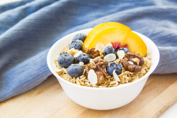 Oatmeal porridge with blueberries. Superfood for healthy nutritious breakfast