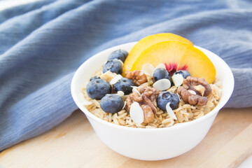 Oatmeal porridge with blueberries. Superfood for healthy nutritious breakfast