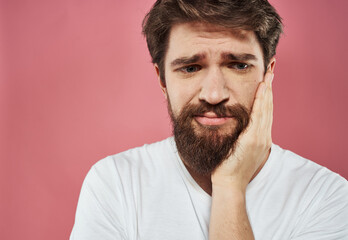 Upset man gesturing with hands stress emotions model pink background