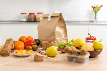 daily meals and snacks. Diet nutrition and brown paper bag package with copy space, Healthy food delivery from a restaurant, delicious food on the background of a paper bag package