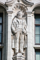 Statue of William Morris on wall of Victoria and Albert Museum, London - 415336683