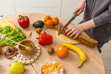 Beautiful pregnant woman smiling with vegetables healthy food in the kitchen. Healthy food concept