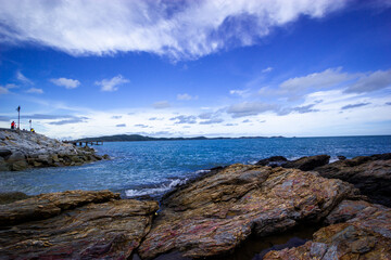 Fototapeta na wymiar sea and rocks , The coast with waves hitting the rocks
