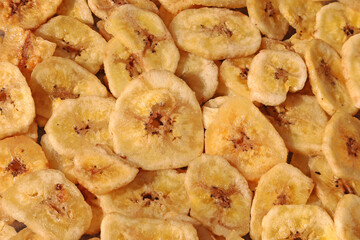 Slices of dried banana as full frame. Background.