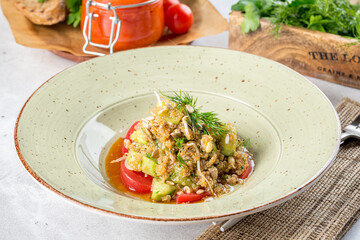 Quinoa salad in a white plate filmed for the menu