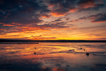 Naklejka na ściany i meble Beautiful sunset on the frozen winter lake, zalew zemborzycki lublin poland