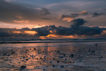 Sunset on the ocean with sun rays, French coast line. 