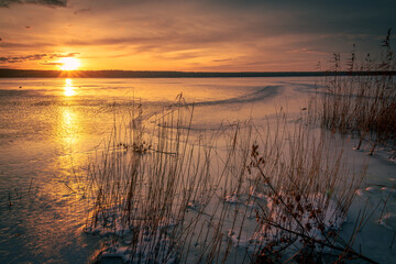 Fototapeta na wymiar Beautiful sunset on the frozen winter lake, zalew zemborzycki lublin poland