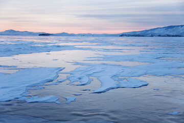 Naklejka na ściany i meble Cape Uyuga sunset landscape. Lake Baikal, winter.