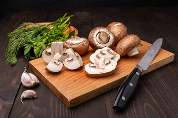 sliced mushrooms on a chopping board with herbs