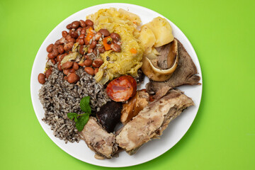 typical portuguese dish boiled meat, smoked sausages and vegetables on white dish