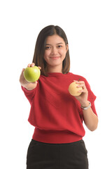 Asian woman is holding an apple with both hands attached to her chest, on white background.