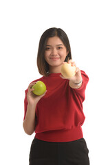 Asian woman is holding an apple with both hands attached to her chest, on white background.