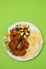 typical portuguese smoked sausage alheira with chips and greens