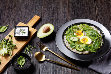 quinoa bowl with greens, avocado and boiled egg