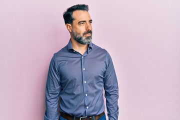 Middle age man with beard and grey hair wearing business clothes smiling looking to the side and staring away thinking. - obrazy, fototapety, plakaty