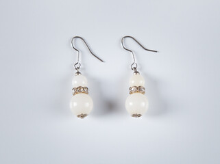 Earrings isolated on white background. Concept of fashion.