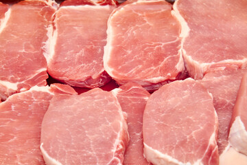 Fresh Pork steaks in a shop window. Close-up, selective focus