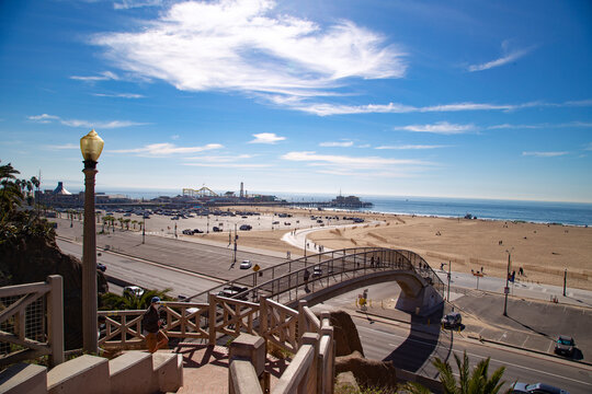 The bridge to Santa Monica beach in Los Angeles California.   with Santa Monica peer on the background. 