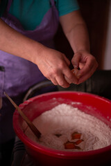 housewife mixing flour with her hands in the bowl. preparing ingredients for traditional homemade cakes